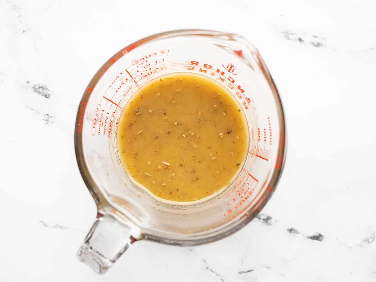 homemade vinaigrette in a glass measuring cup