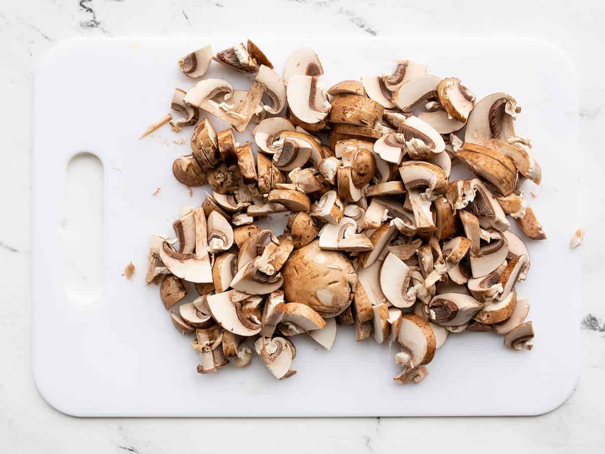 sliced mushrooms on a cutting board