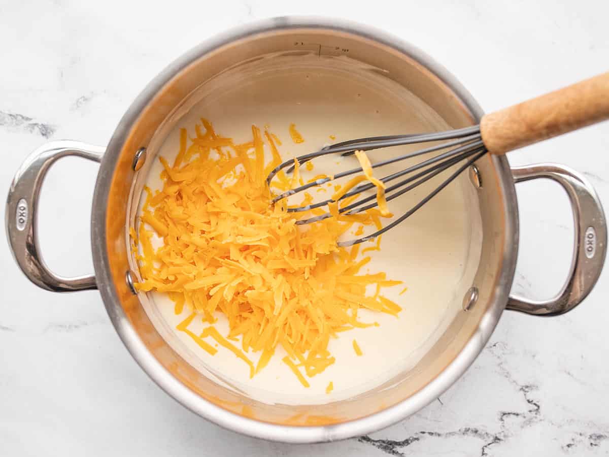 shredded cheddar added to the pot