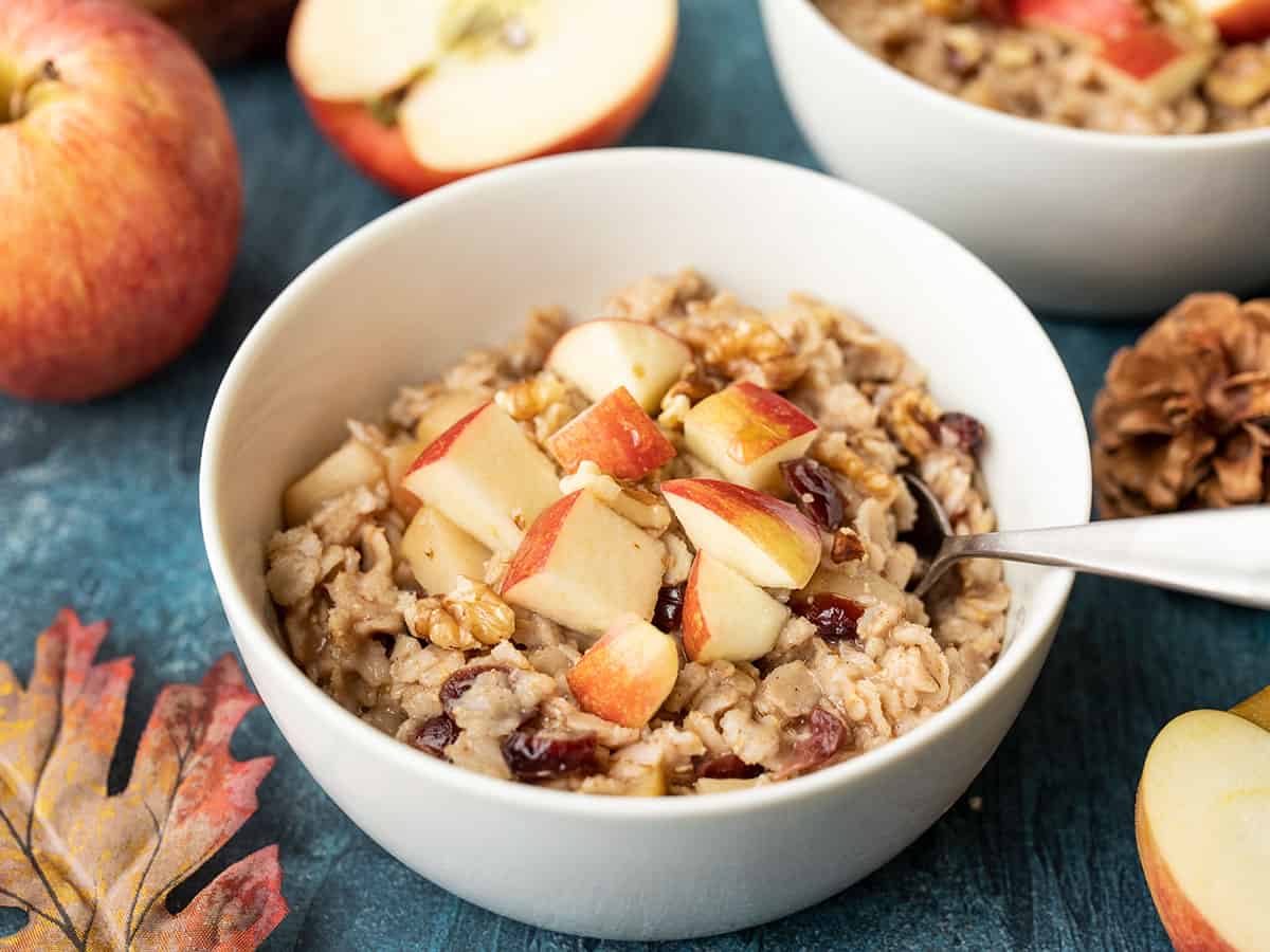 side view of a bowl of autumn fruit and nut oatmeal