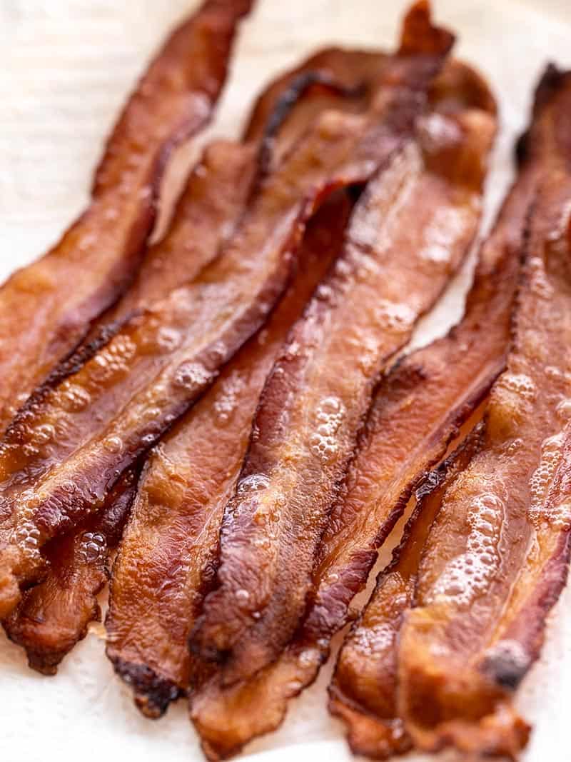 Strips of hot bacon piled on a plate
