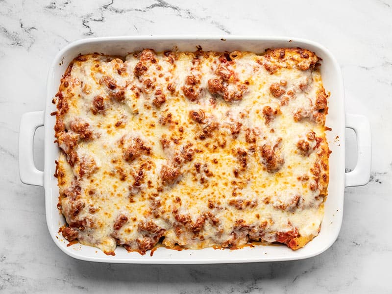 Broiled baked ziti with browned cheese on top
