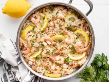 overhead view of lemon garlic shrimp and rice in a skillet