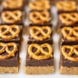 front view of no bake pretzel peanut butter bars lined up in a grid