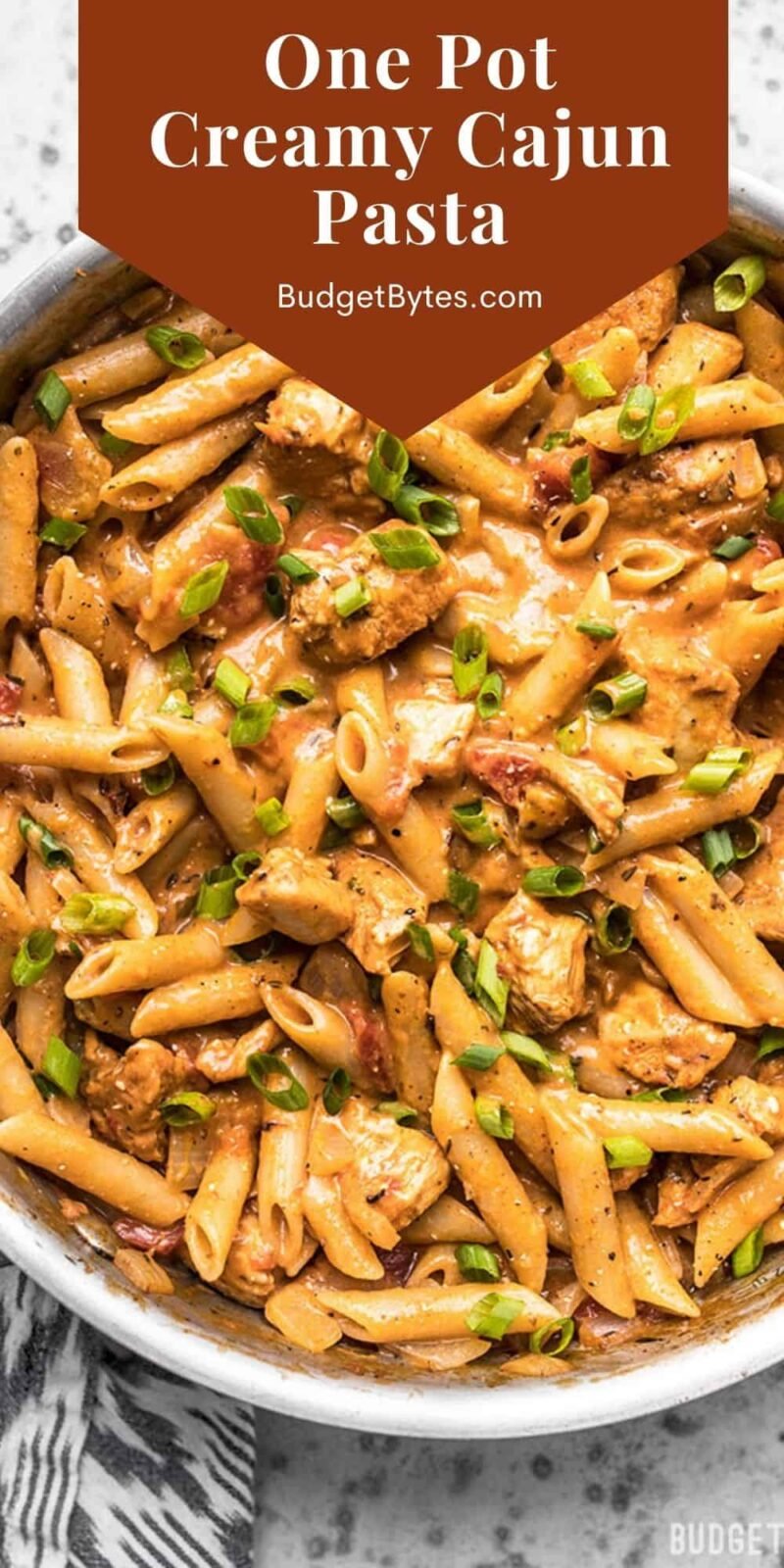 Overhead view of a skillet full of cajun chicken pasta