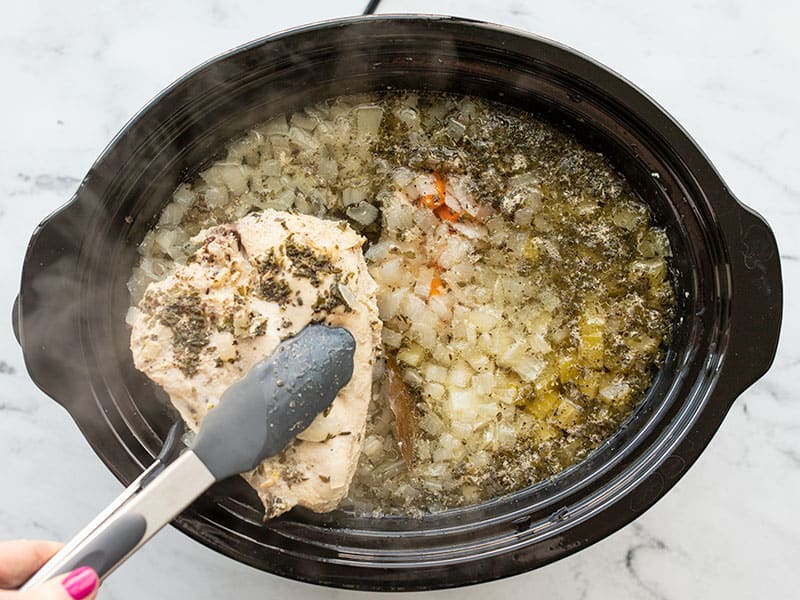 Remove cooked chicken from slow cooker
