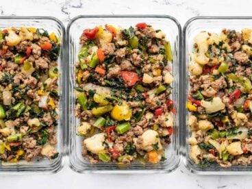 Sausage and Vegetables in glass meal prep containers.