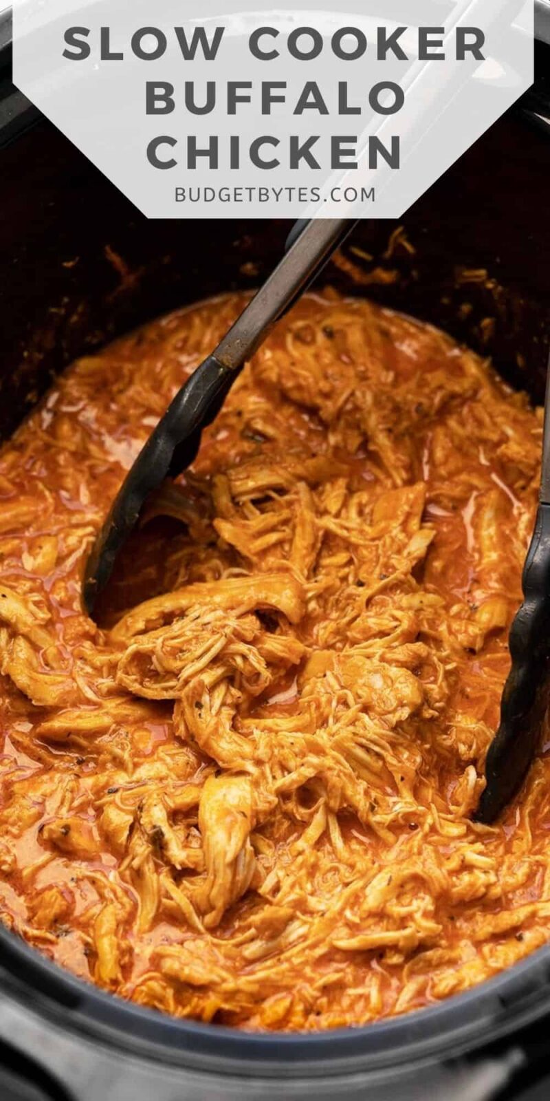 close up of slow cooker buffalo chicken in the crock pot, title text at the top