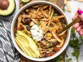This Slow Cooker Chicken Tortilla Soup offers a deep, comforting, smoky flavor with simple ingredients and minimal effort. BudgetBytes.com