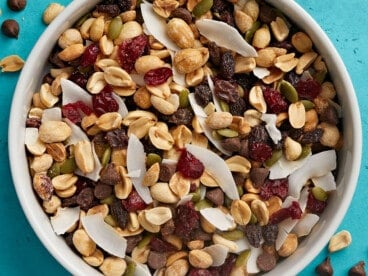 Overhead close up view of a bowl full of trail mix.